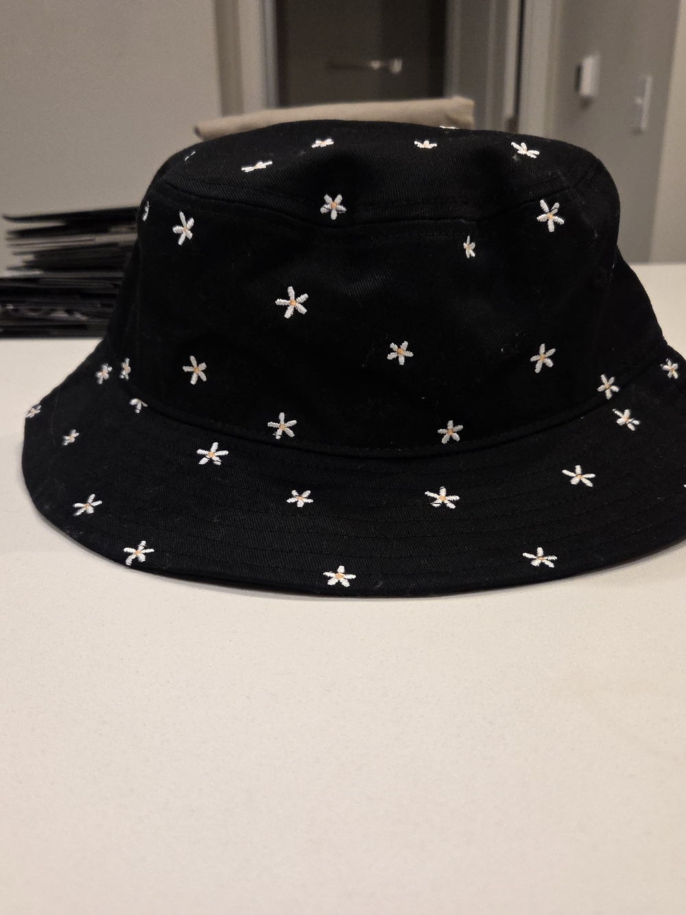 PacSun Black Bucket Hat with White Daisy Embroidery